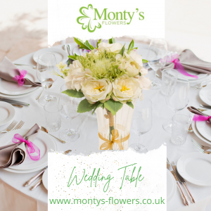 a beautifully set table for weddings with Monty's Flowers as a centrepiece, logo and the words Wedding Table www.montys-flowers.co.uk